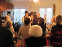 Епископ П.Бруверс в сослужении пастора А.Кронбергса совершает освящение капеллы в доме общины